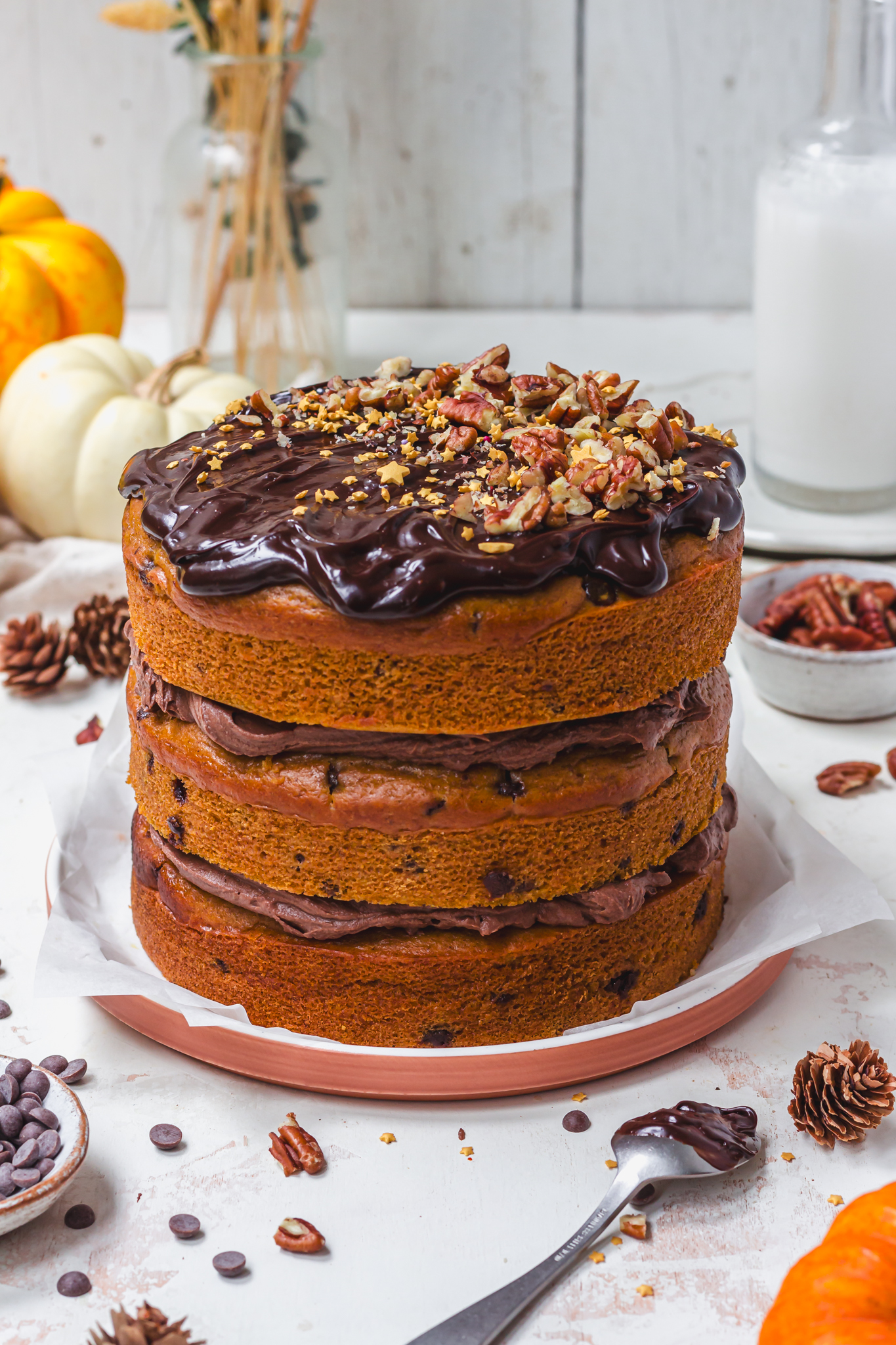 A Pumpkin Spice Chocolate Chip Cake with three layers