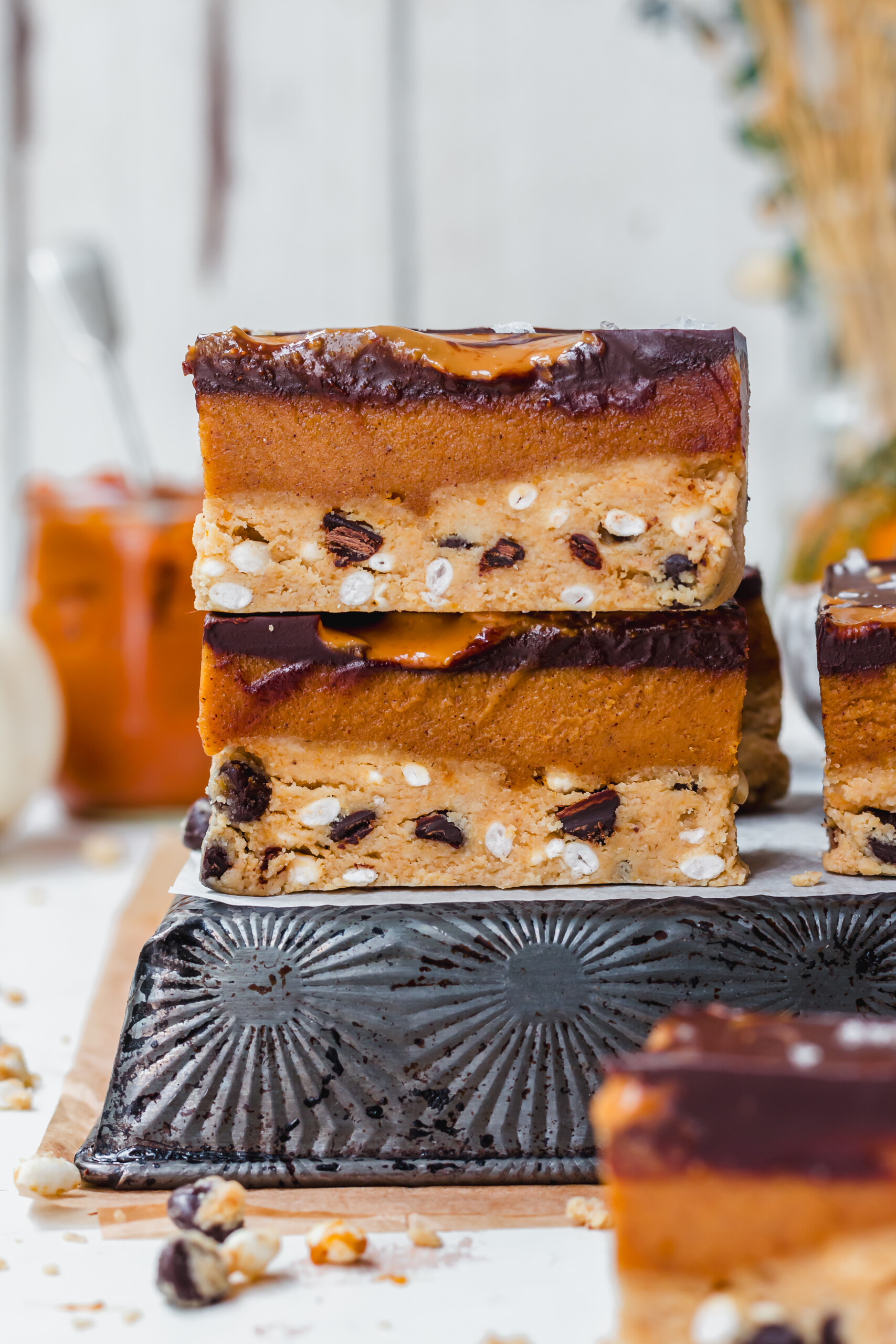 Two Chocolate Pumpkin Fudge Crunch Bars on top of each other