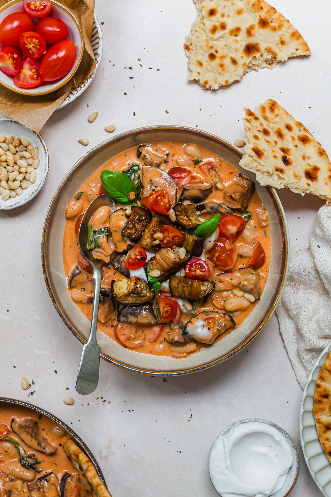 A bowl of Roasted Aubergine Creamy Tomato Beans