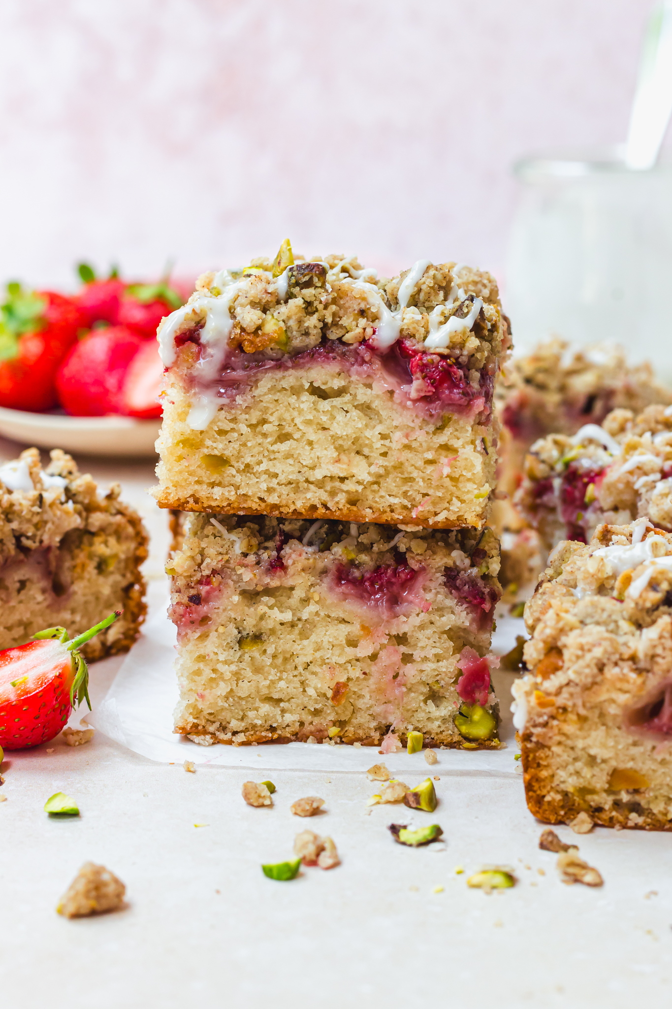 Two squares of Strawberry Pistachio Crumble Cake