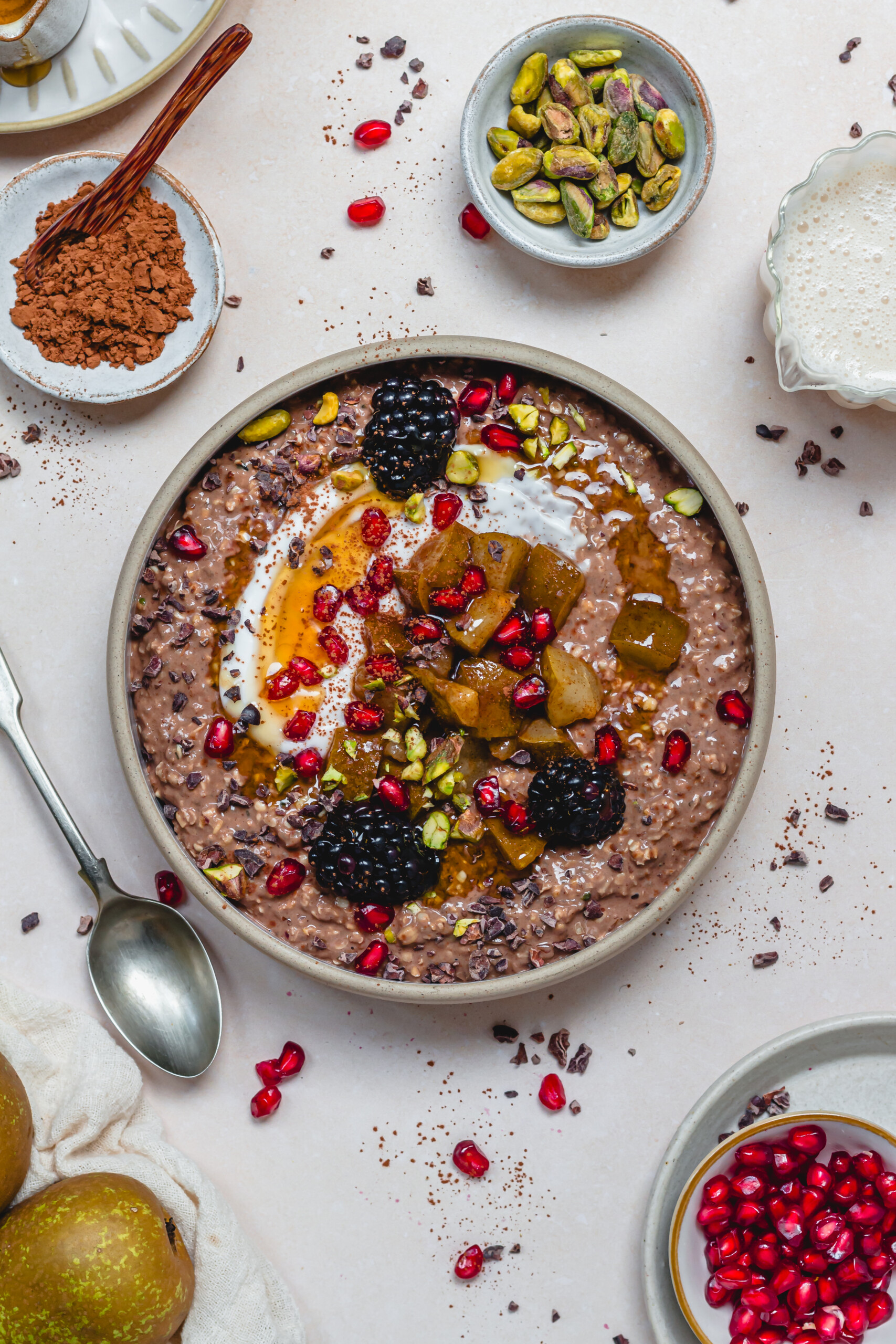 A bowl of Pear Ginger Chocolate Overnight Oats with syrup