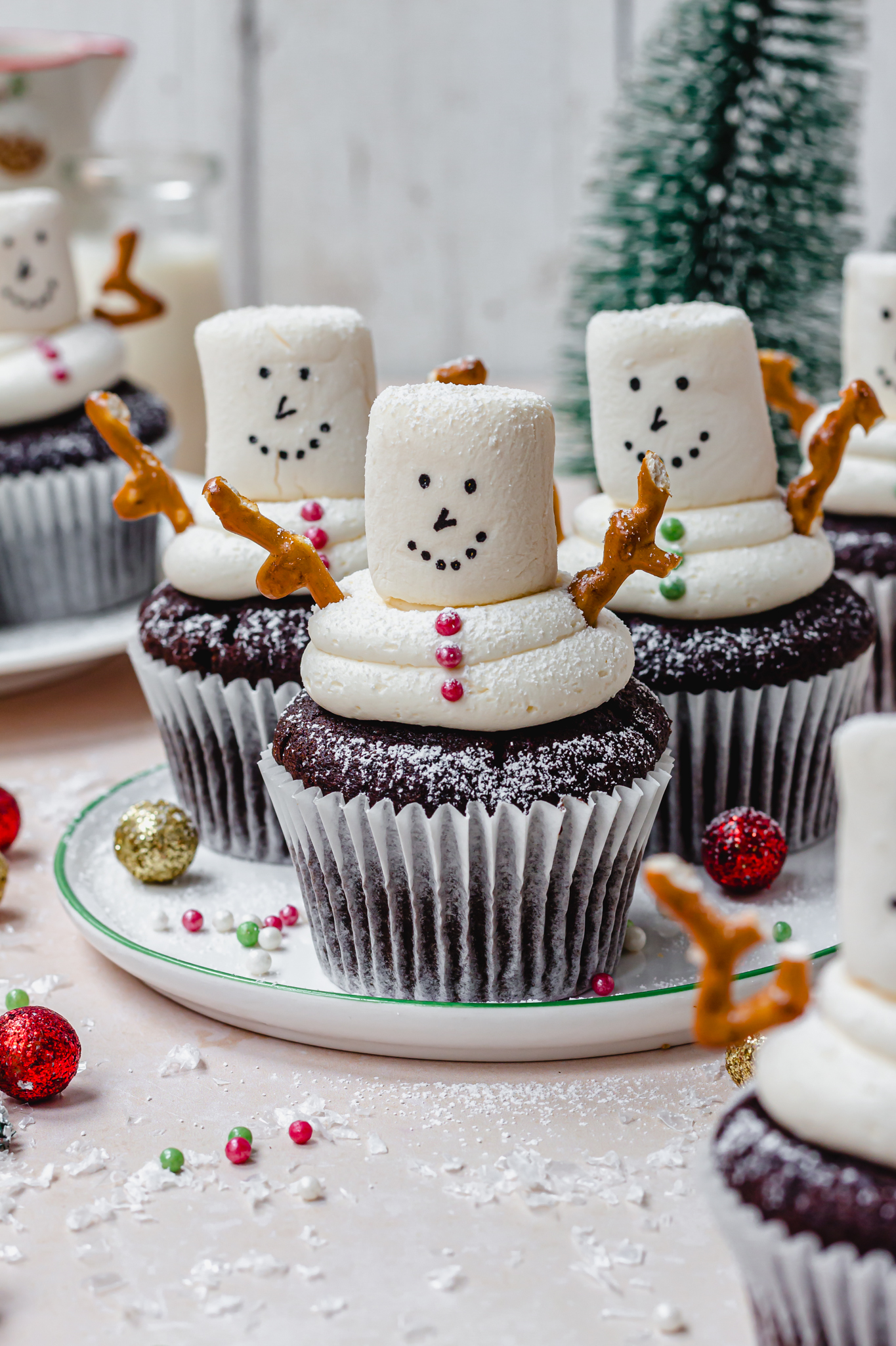 A plate of Chocolate Snowman Cupcakes