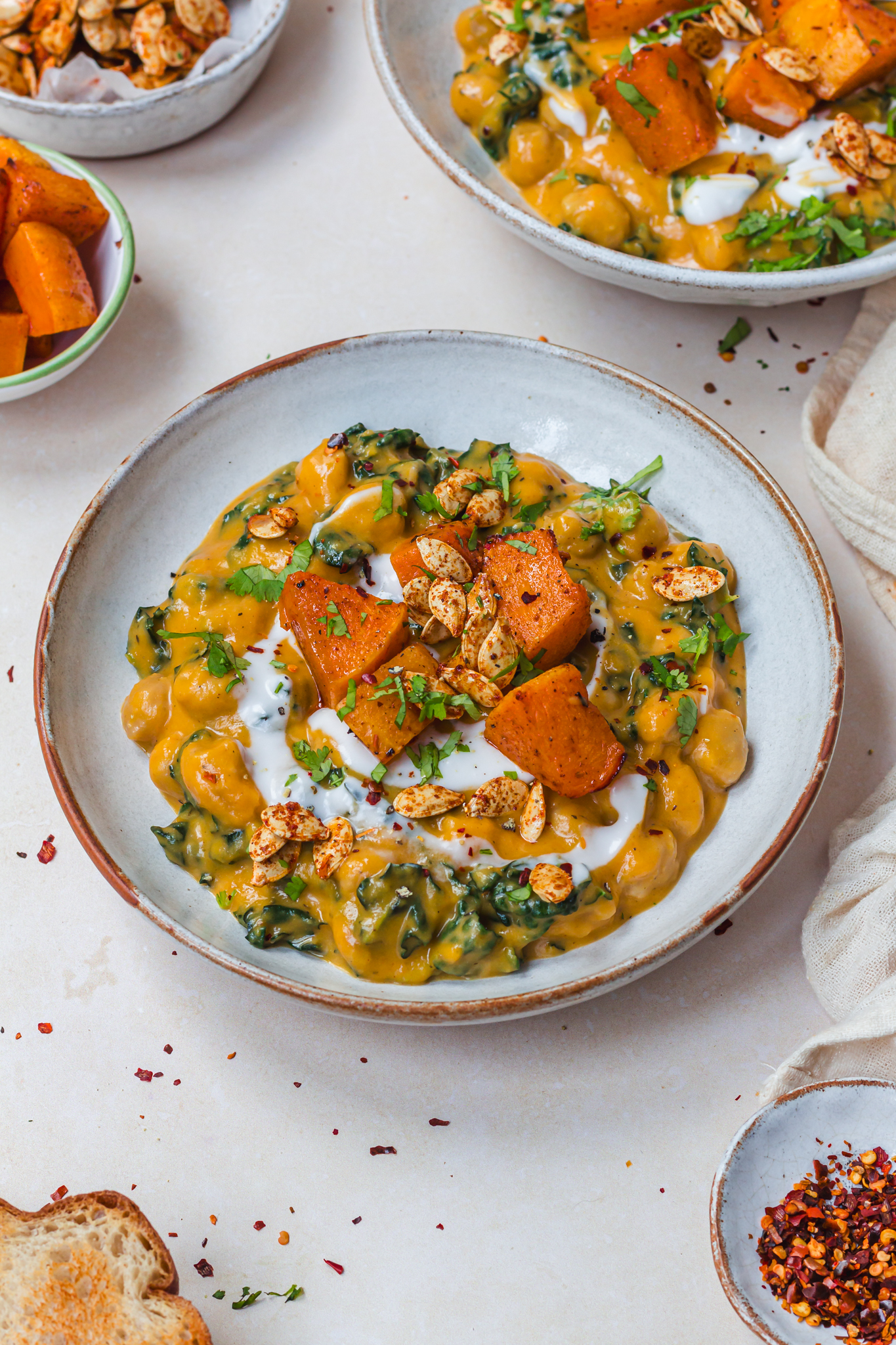 A bowl of Creamy Roasted Butternut Squash with Chickpeas and Kale