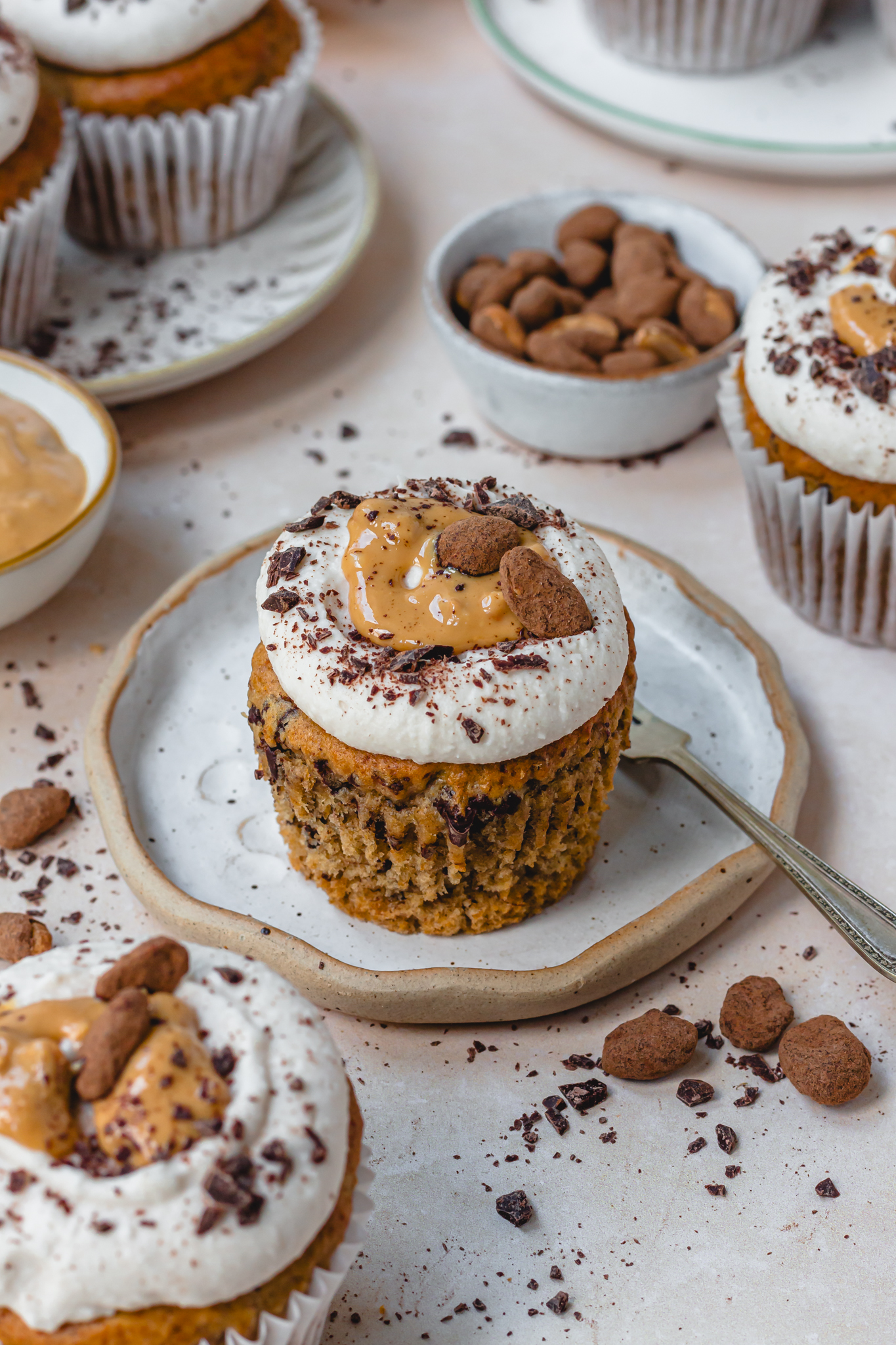 A Peanut Butter Chocolate Chip Banana Cupcake on a plate