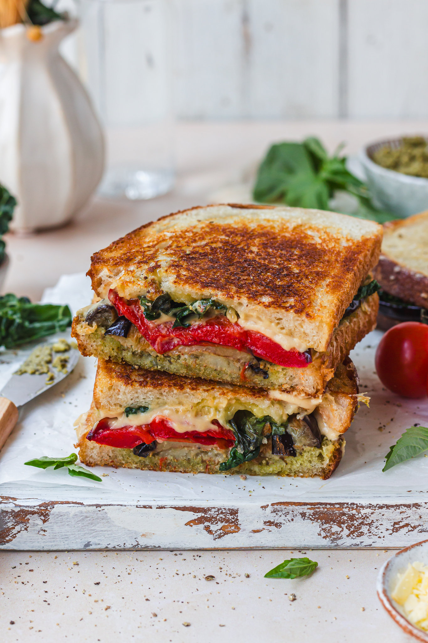 Two halves of a Pesto Vegetable Cheese Toasted Sandwich