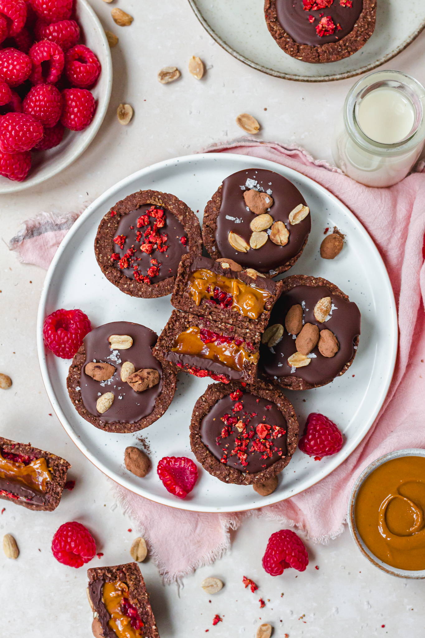 A plate of Chocolate Brownie Peanut Butter Raspberry Cups