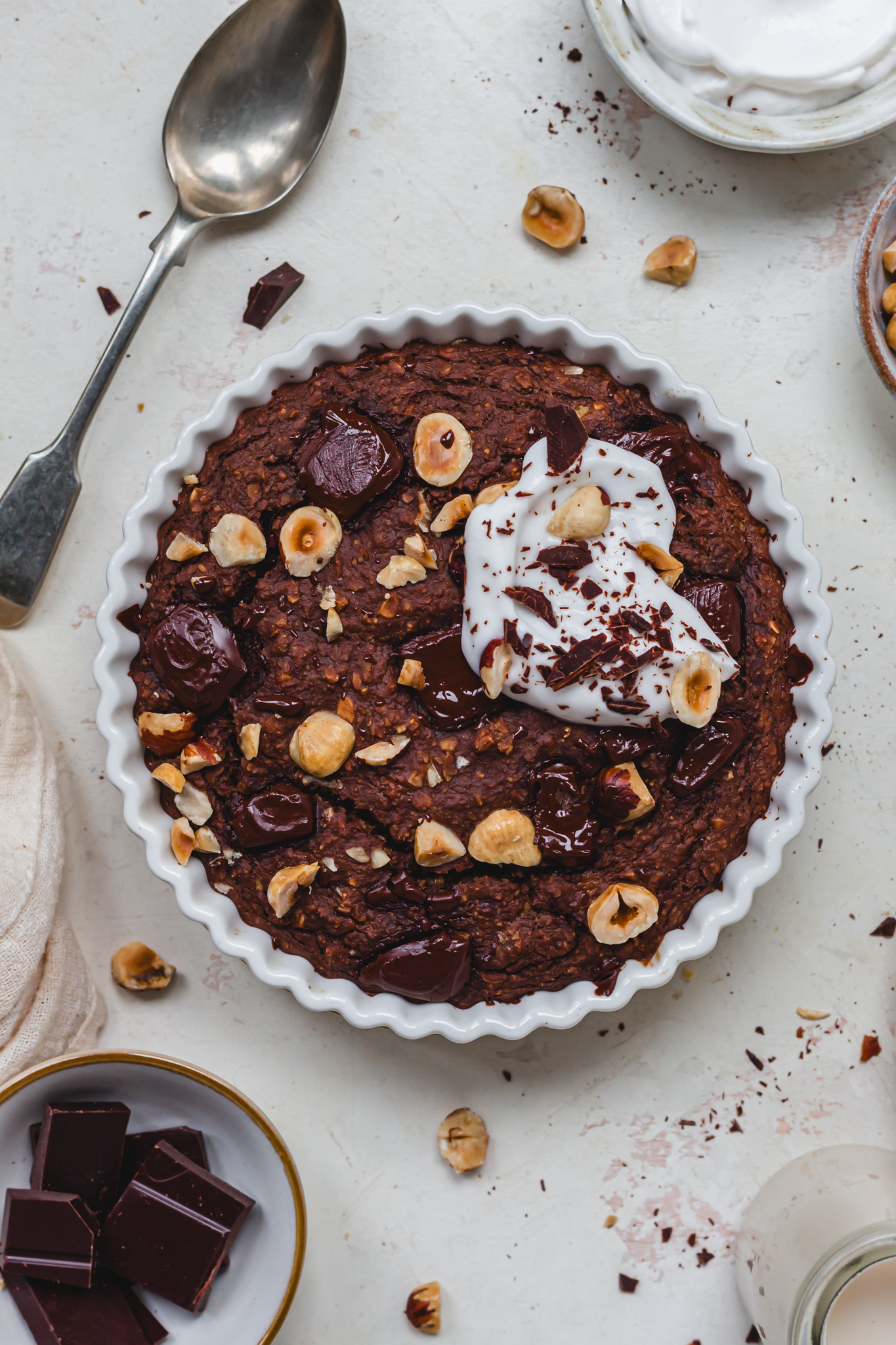 A dish of Chocolate Hazelnut Baked Protein Oats with yoghurt