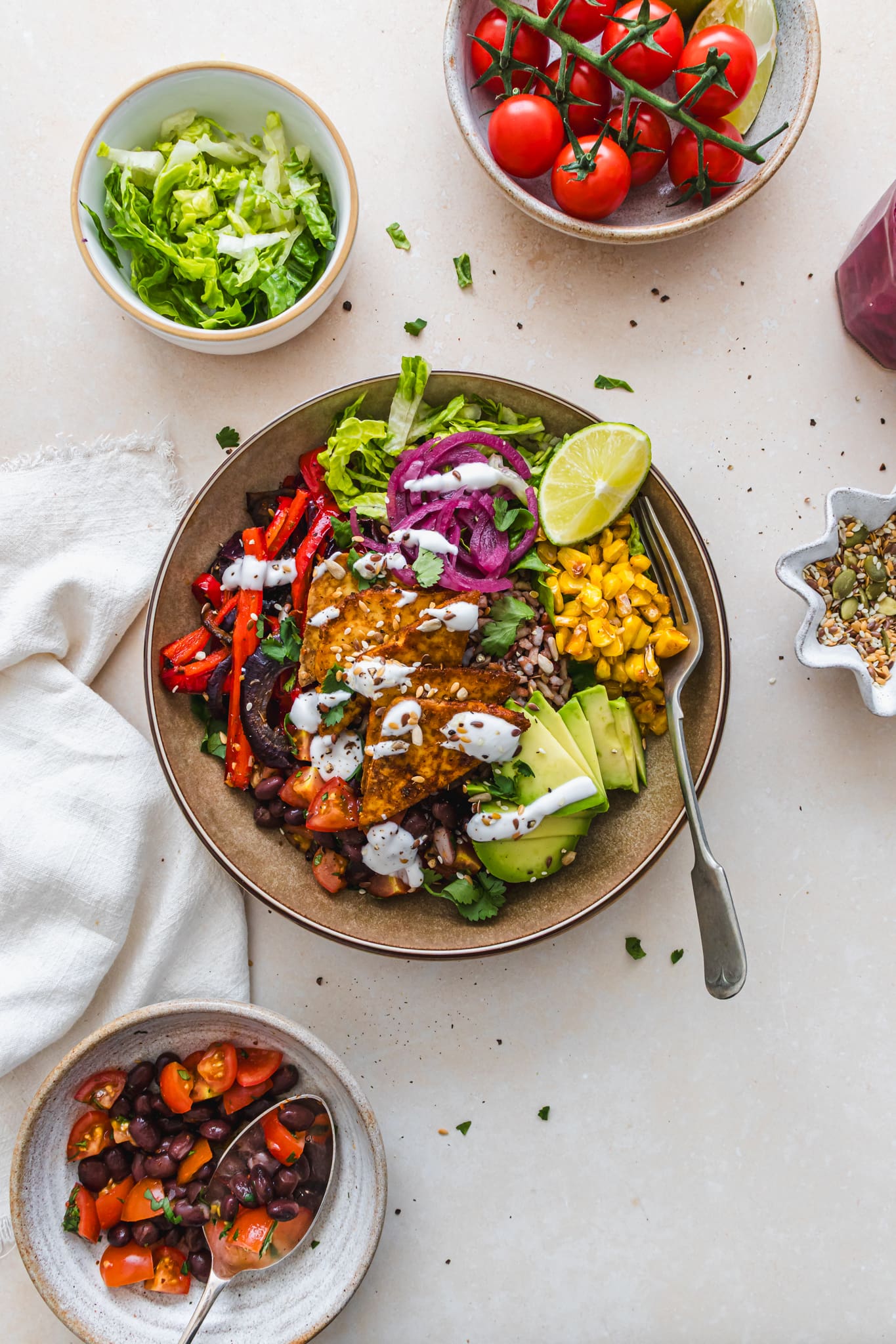 A Mexican Fajita-Style Tofu Rice Bowl with a fork