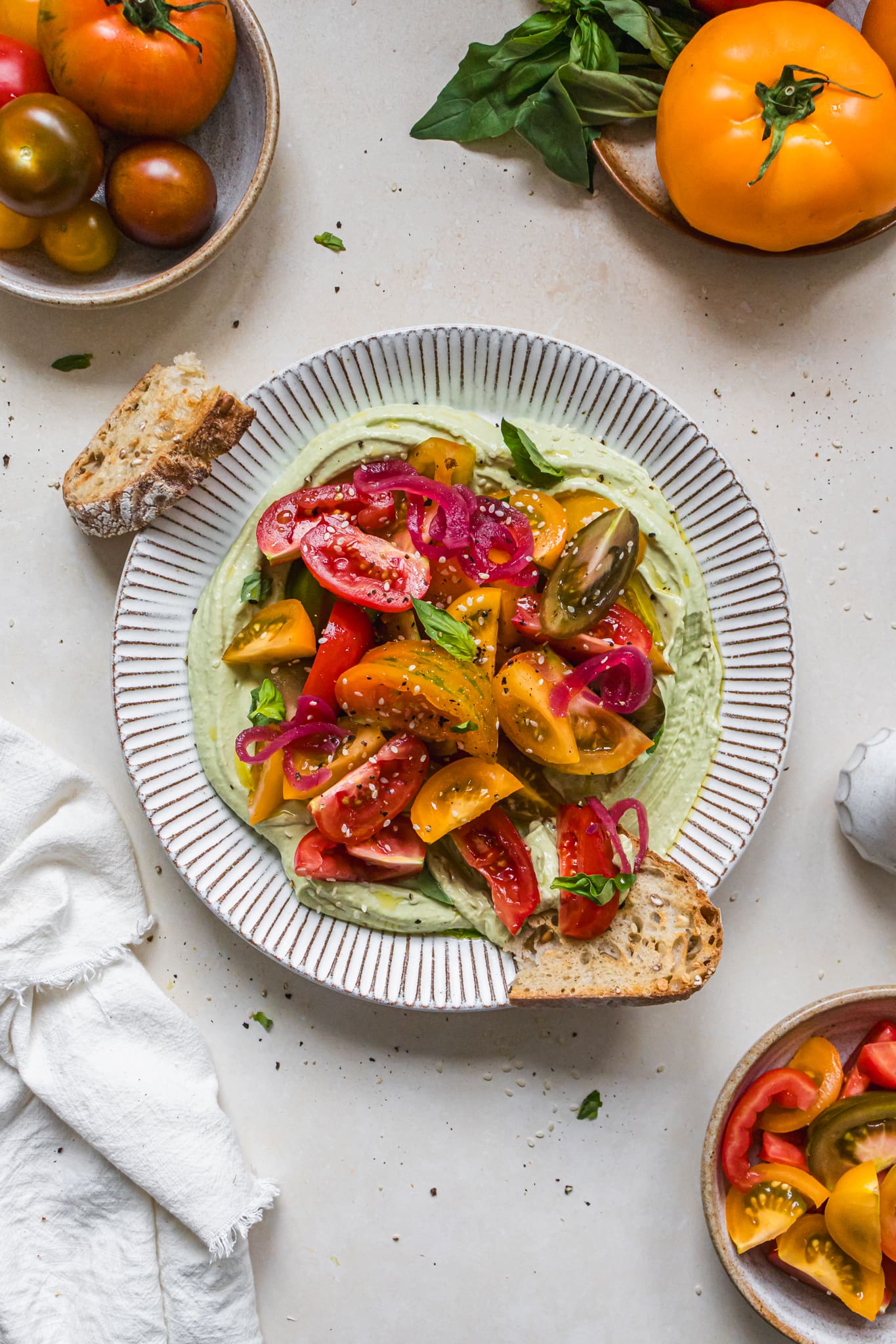 A plate of Tomato Salad and Herby Tofu Cream Cheese