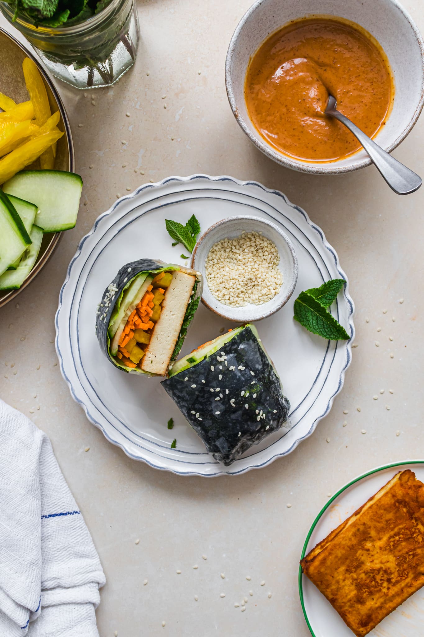 A Gochujang Tofu Rice Paper Roll in half