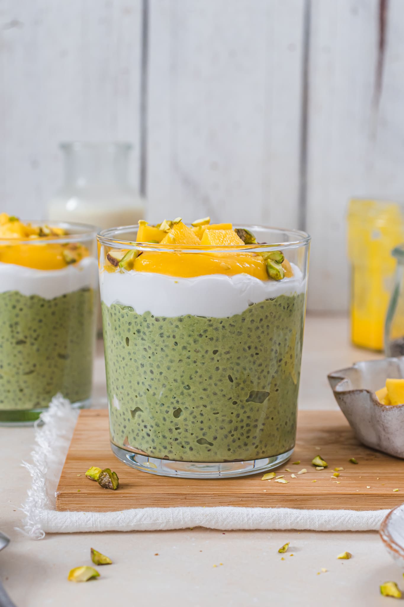Two pots of Mango Matcha Chia Pudding