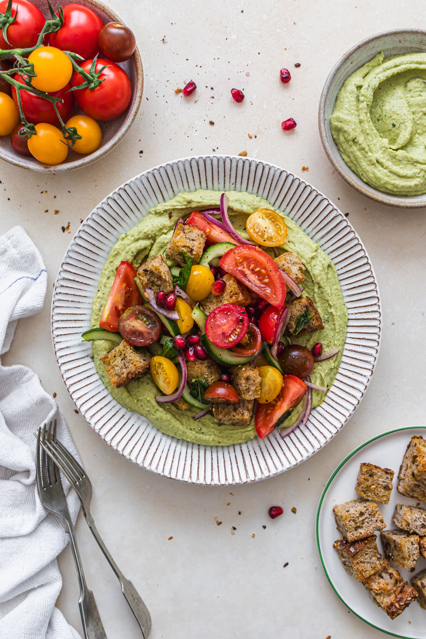 A plate of Tomato Bruschetta Salad on Herby Hummus