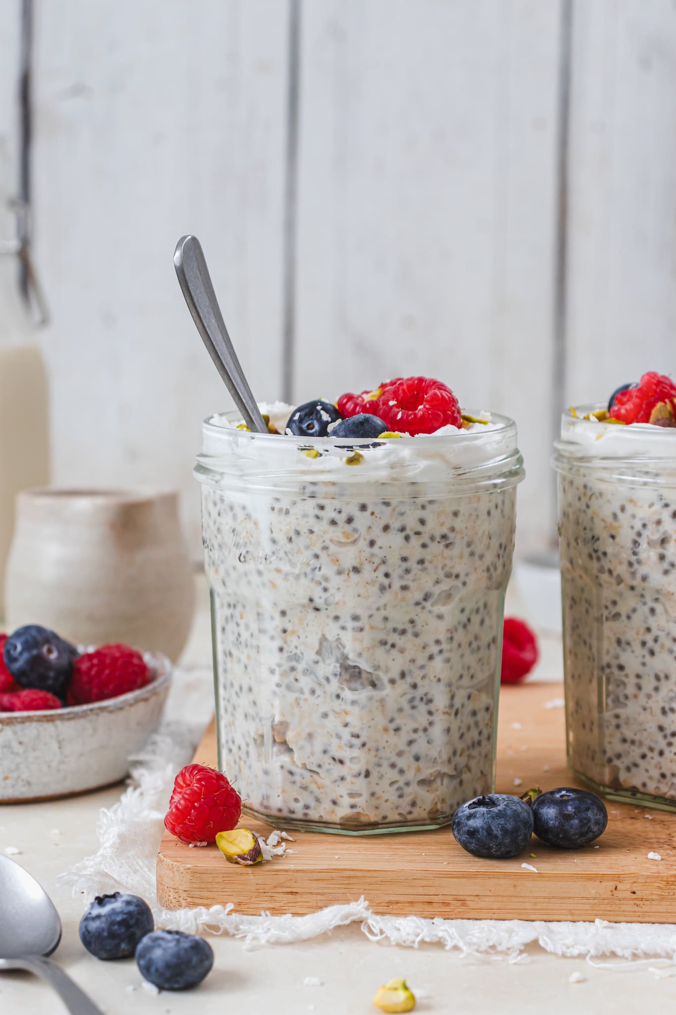 A jar of Coconut Water Overnight Oats with a spoon