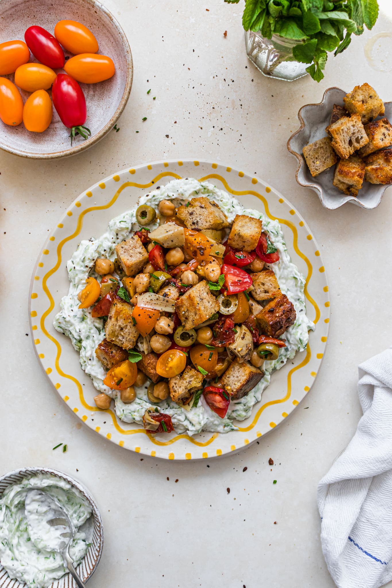 A plate of Mediterranean Tzatziki Panzanella Loaded Salad