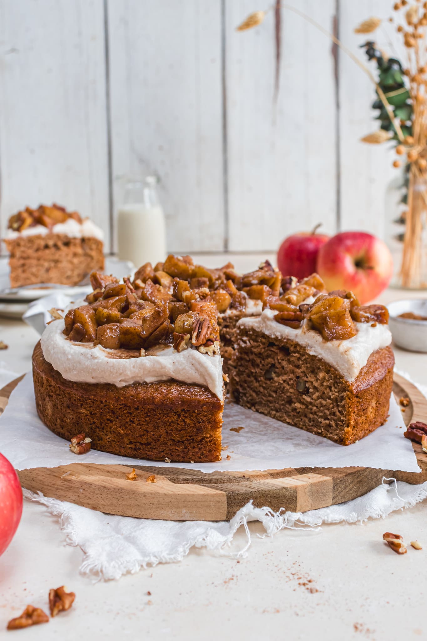 A cut up Chai Caramel Apple Pecan Cake